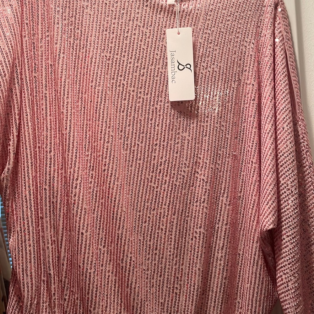 Brand new pink sequins top .